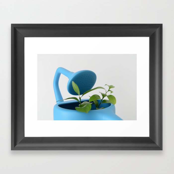 The Uncomfortable watering can and leaves Framed Art Print