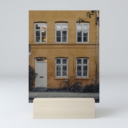 Orange house and a bike Mini Art Print