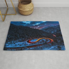 TIMELAPSE PHOTOGRAPHY OF CURVED ROAD BETWEEN MOUNTAIN WITH TREES Rug
