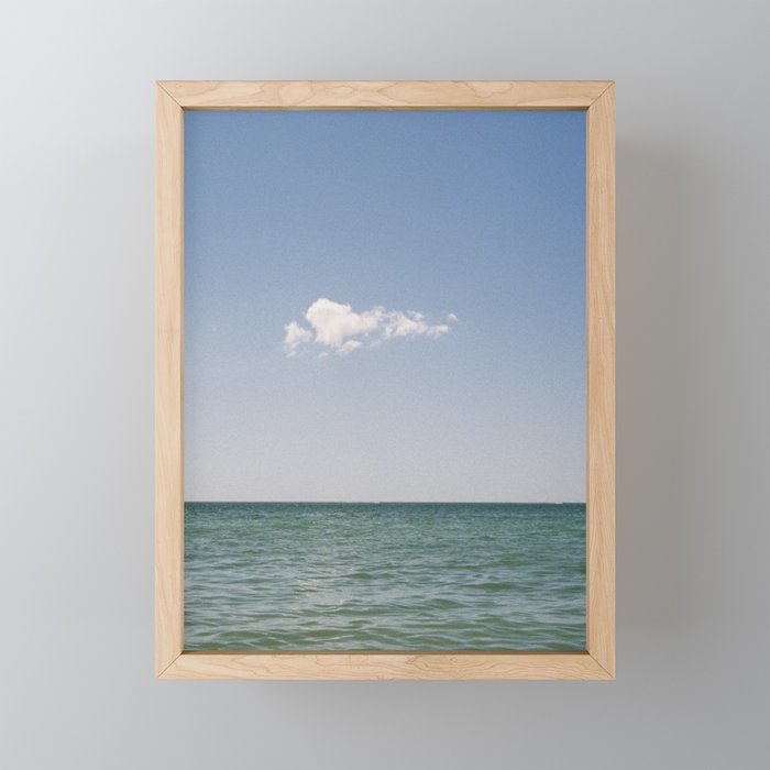 a lonely cloud Framed Mini Art Print
