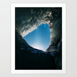 Looking out of a hole in the ice - an ice cave in a glacier Art Print
