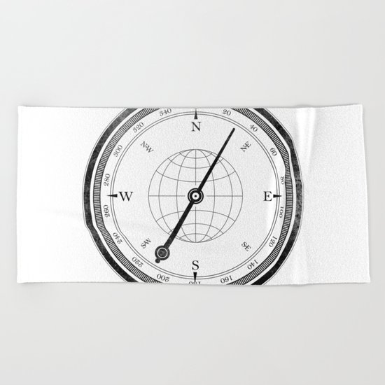 Textured Compass on White Beach Towel