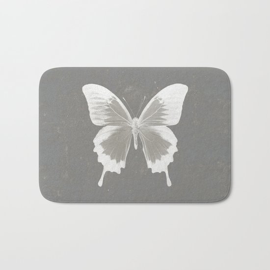 Butterfly on grunge surface Bath Mat