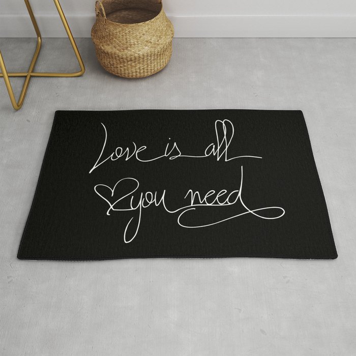 Love is all you need white hand lettering on black Rug