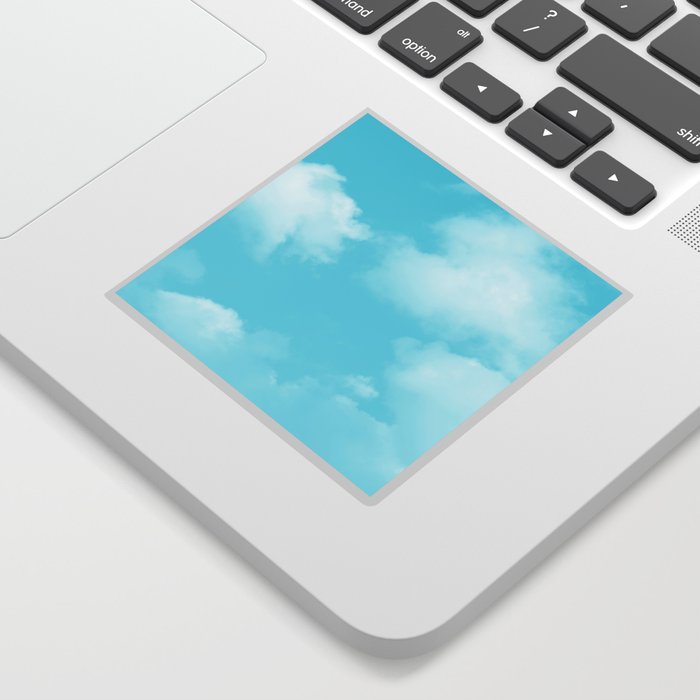 Cute puffy small white clouds on a sunny aqua blue sky Sticker