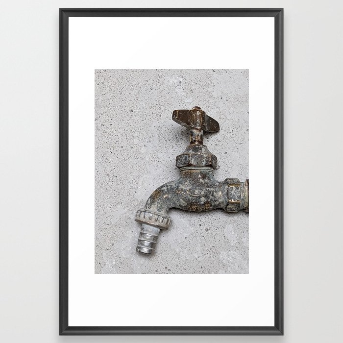 Copper water faucet over gray cement Framed Art Print