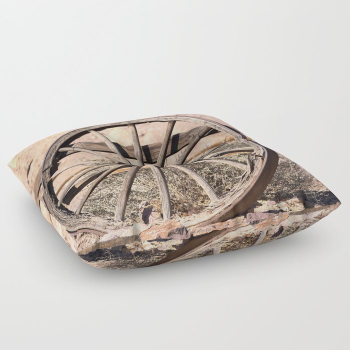 Old wagon wheel against a fence Floor Pillow