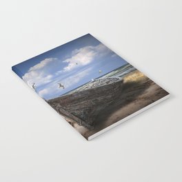 Stranded Boats on a Beach under a Cloudy Blue Sky Notebook