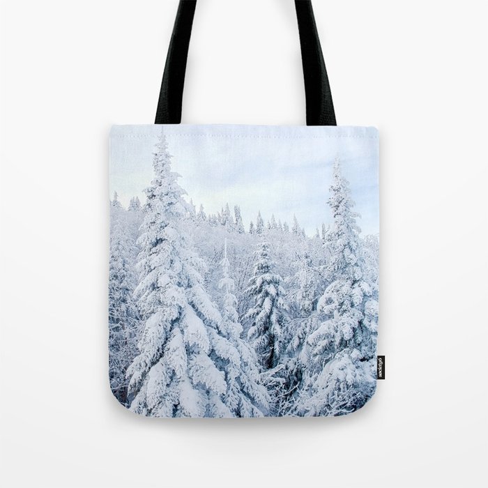 Snow covered forest Tote Bag