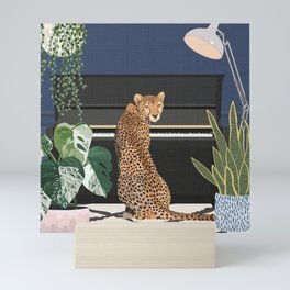Cheetah playing piano Mini Art Print