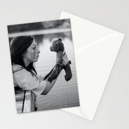 School daze; girl pulling childhood teddy bear out of lake breakup relationship female black and white photograph - photography - photographs Stationery Card