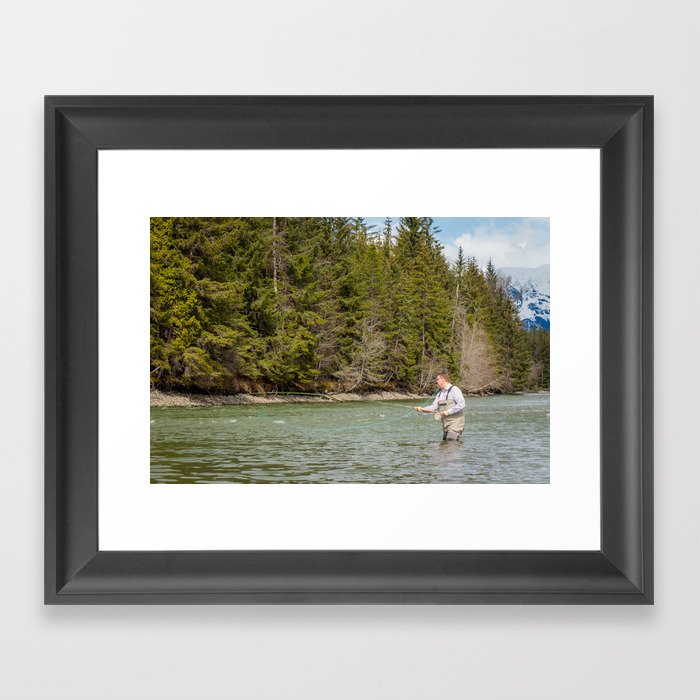 Close up of a fisherman spey casting on a river in British Columbia, Canada, in the spring Framed Art Print