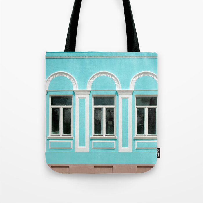  Old city, Prettily suburban town. Architectural details and decoration of the vintage stucco facade framing the windows - console, protome, mascaron, capital, pilasters, wreaths, relief and other.  Tote Bag