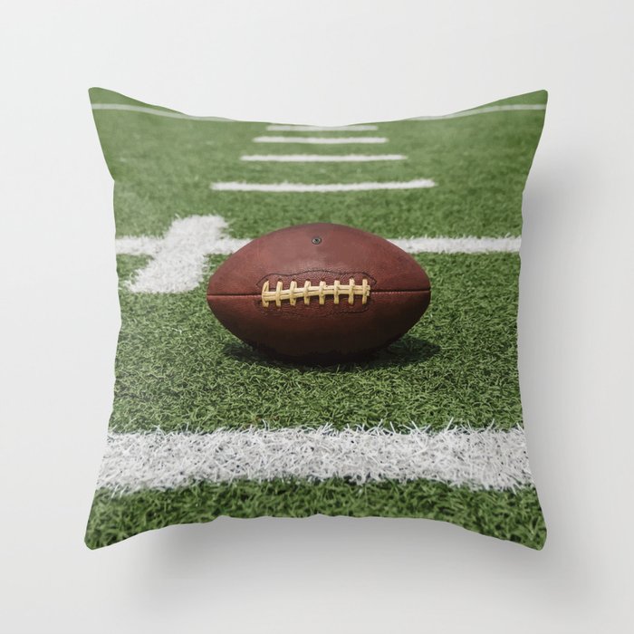 American Football Court with ball on Gras Throw Pillow