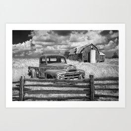 Black and White of Rusted International Harvester Pickup Truck behind wooden fence with Red Barn in Art Print
