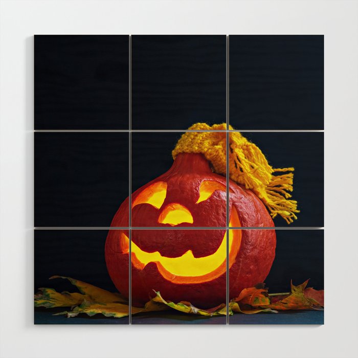 Glowing Pumpkin with Autumn Leaves on a Dark Background. Jack's Lantern. Halloween Decoration Wood Wall Art