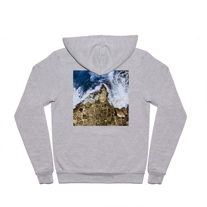 An abstract of the ocean and the coastal rocks. Hoody