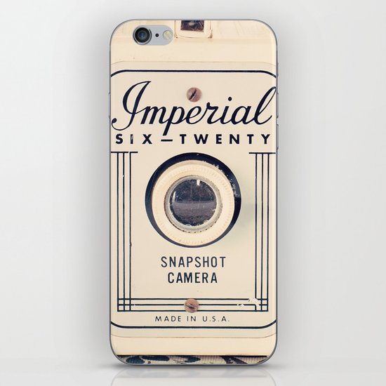 Retro Beige Camera on a Violet Paisley Background iPhone Skin
