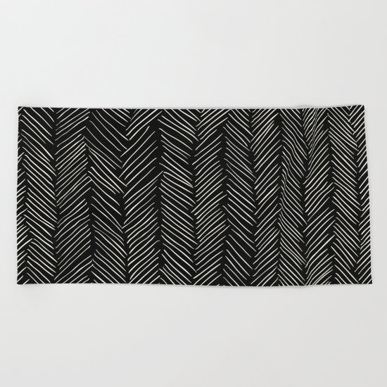 Herringbone Cream on Black Beach Towel