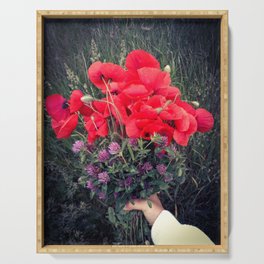 Summer red poppies and clover bloquet in woman's hand field essence Serving Tray