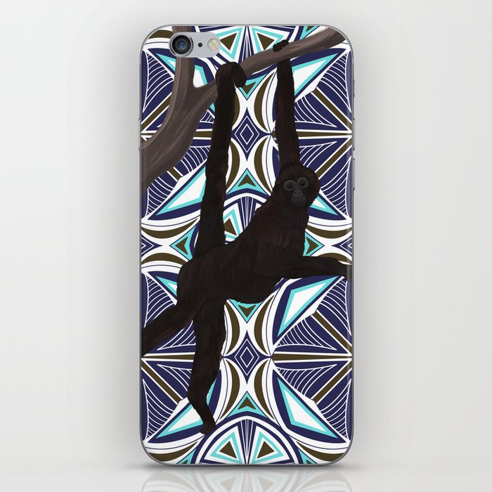 Spider monkey in tree on blue patterned background iPhone Skin