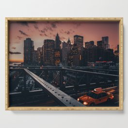 New York City Manhattan Skyline and Brooklyn Bridge with a yellow taxi at sunset Serving Tray
