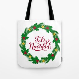 Feliz Navidad calligraphy hand lettering with wreath of fir tree branches Tote Bag