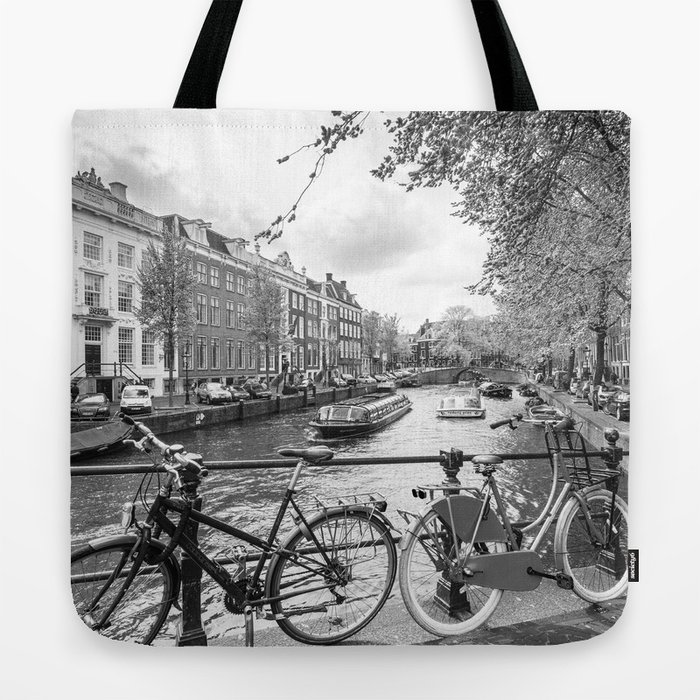 Bicycles parked on bridge over Amsterdam canal Tote Bag