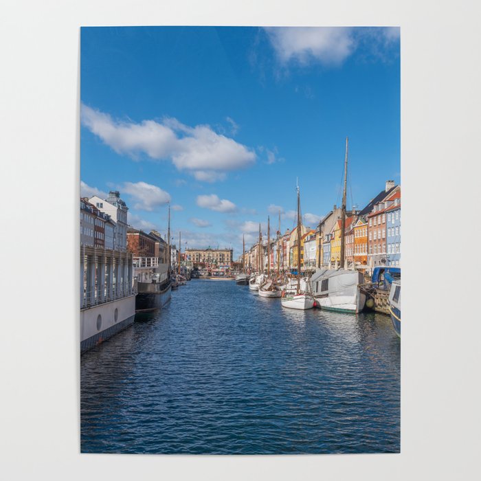 Nyhavn Canal under a blue sky with some clouds Poster