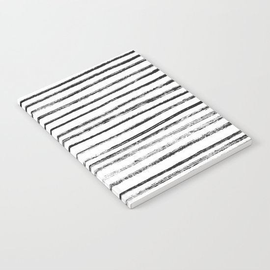 Black Brush Lines on White Notebook