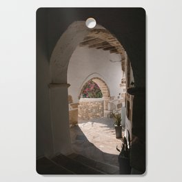 Sunny Peek Through in Greek Village | Stone Alley with Flowers | Ancient Town on the Cycladic Islands in Mediterranean Area | Travel Photography Cutting Board