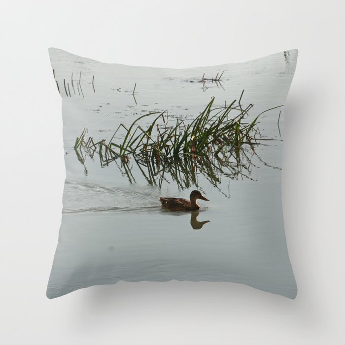 Young Duck swimming in the river Throw Pillow