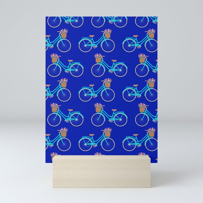 Bicycle with flower basket on blue Mini Art Print