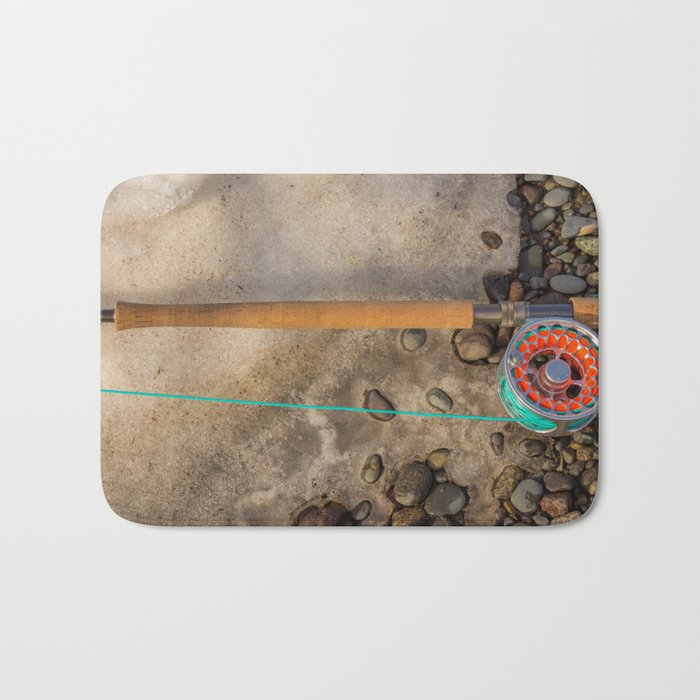 Salmon spey fly rod and reel resting on gravel and snow in British Columbia, Canada Bath Mat