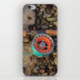 Salmon spey fly rod and reel resting on gravel and snow in British Columbia, Canada iPhone Skin