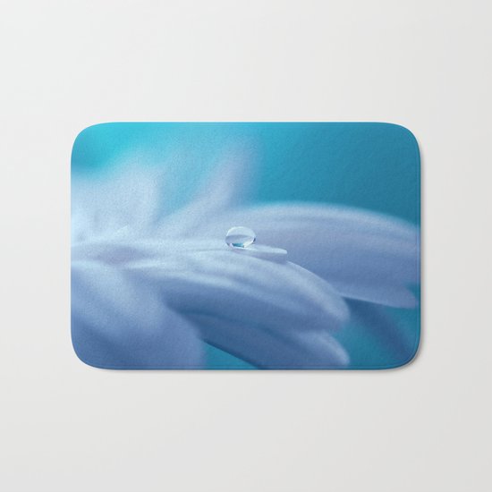 Lonely droplet on a daisy in blue on #Society6 Bath Mat
