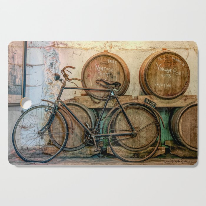 Antique bicycle at the wine estate - Vintage 2009 Cutting Board
