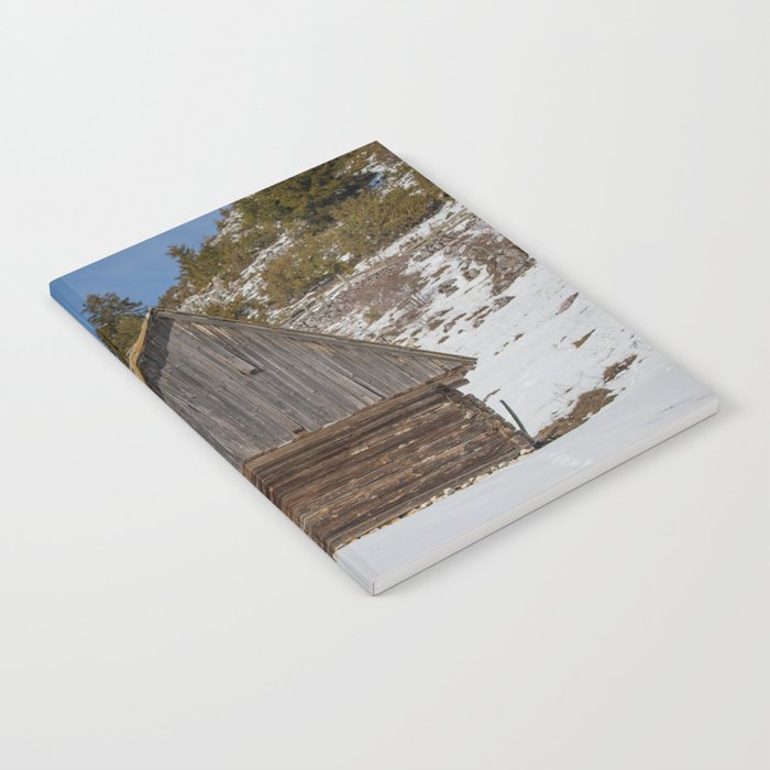 Old mountain house with Carpathian mountains in the background Notebook