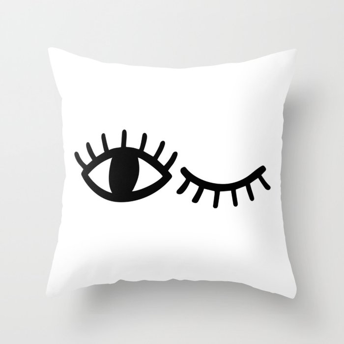 Pillows with eyelashes top on them