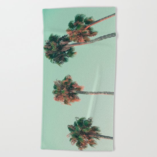 Palm trees at sunset Beach Towel