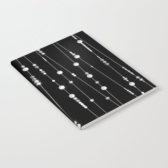 . Pearl beads on a black background Notebook