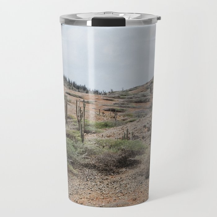 The dry rocky desert of Aruba with cacti and warm earthy colors Travel Mug