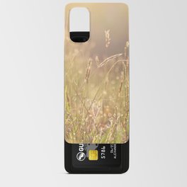 Soft morning sun light shining on the dew on sweet vernal grass. Android Card Case