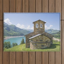 Lake Roselend chapel - church next to a reservoir in the french alps - travel photography Outdoor Rug