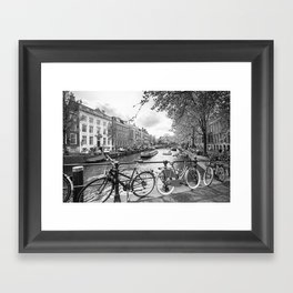 Bicycles parked on bridge over Amsterdam canal Framed Art Print