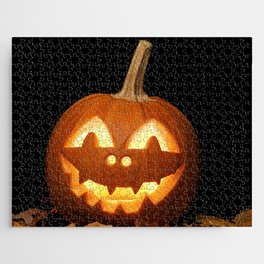Carved Pumpkin for Halloween and Autumn Leaves on Black Background Jigsaw Puzzle