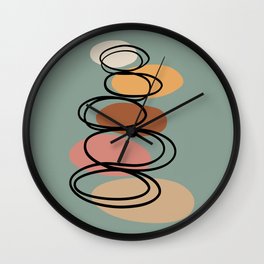 Modern minimalist balancing stones in earth tones illustration on calming green background Wall Clock