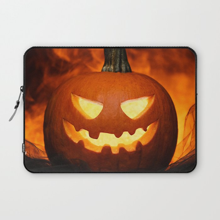 Carved Pumpkin for Halloween on Dark Background Laptop Sleeve