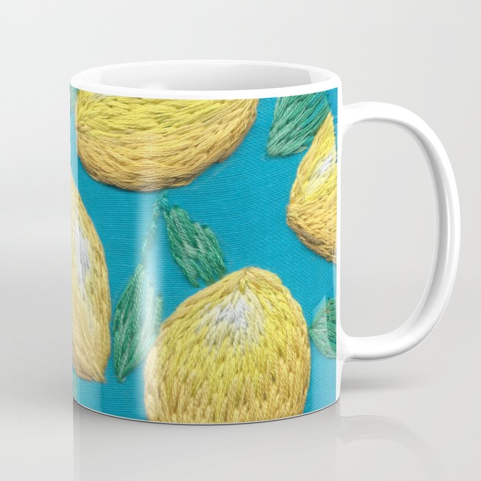 Hand embroidered lemons pattern on turquoise Coffee Mug