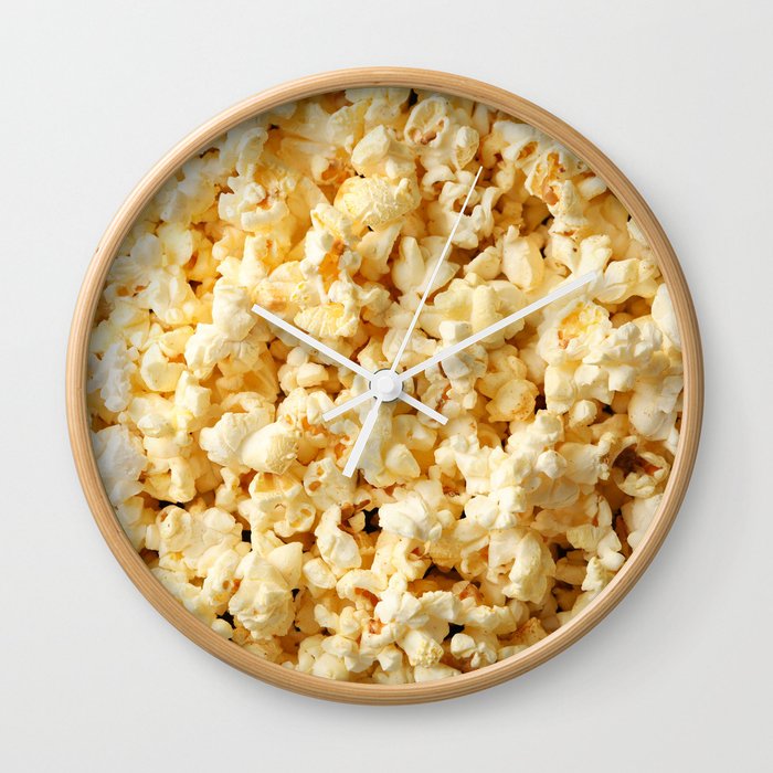 Tasty popcorn on whole background. Food for watching cinema Wall Clock